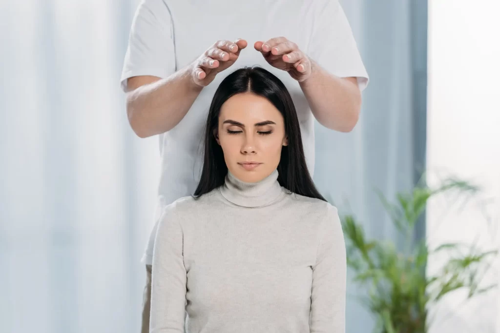 A woman blocking negative energies from the mind.