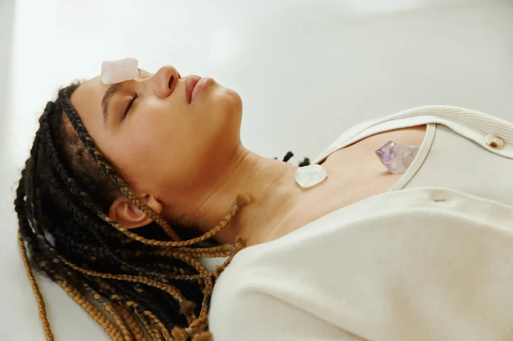 A young african american woman during crystal healing.